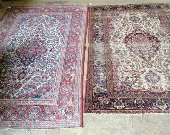 An Isfahan rug (worn) and another rug, largest 216 x 132cm